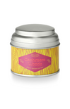 Candle tin labeled 'Cashmere Woods' with a yellow label on a white background