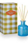 Blue diffuser bottle with wooden sticks next to a checkered box labeled 'Palo Santo Tobacco'.