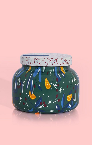 Decorative jar with colorful patterns on a pink background