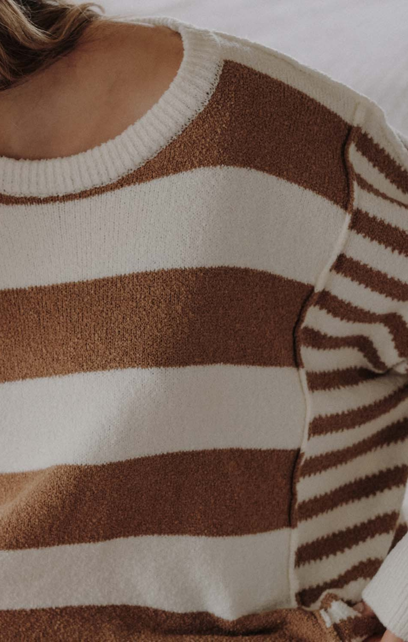 Close-up of a brown and beige striped sweater