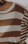 Close-up of a brown and beige striped sweater