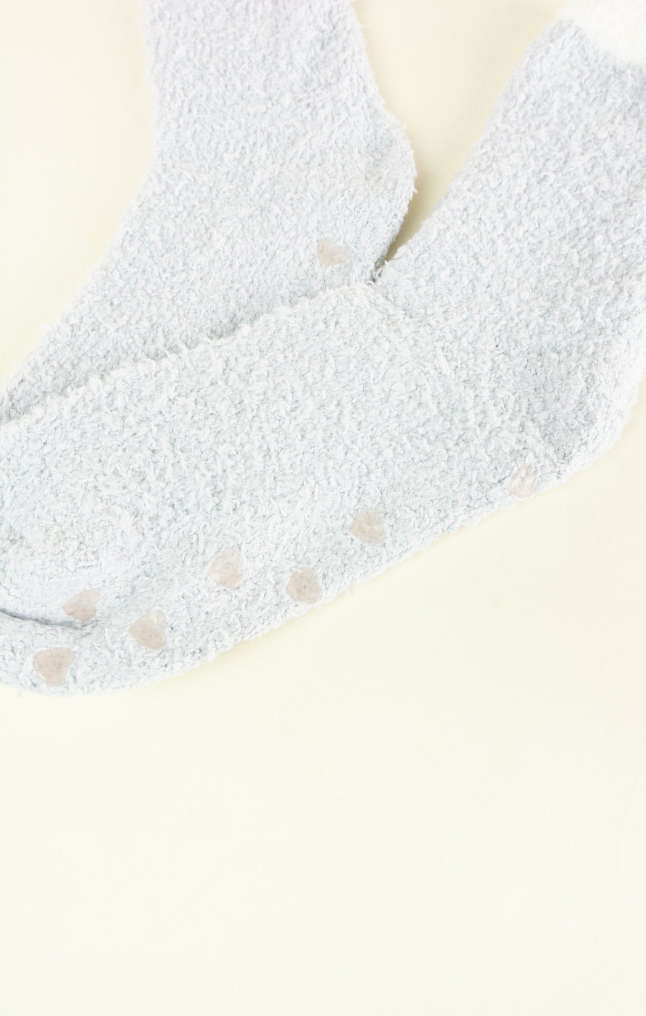 Close-up of a textured gray fabric with a neutral background