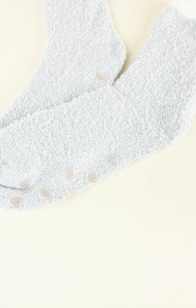 Close-up of a textured gray fabric with a neutral background