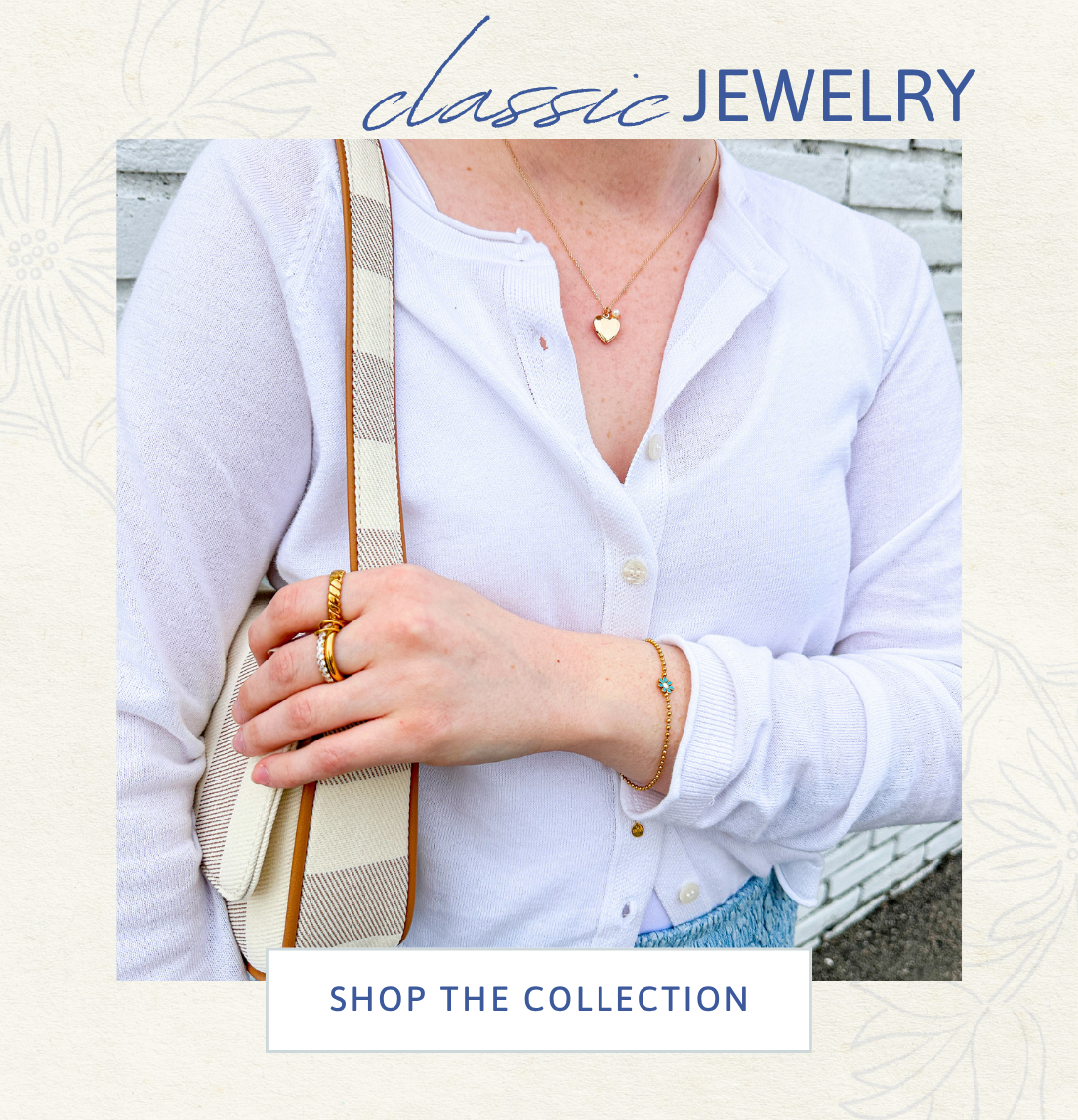 Person wearing classic jewelry with a plain background