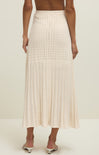 Beige crochet skirt worn by a person on a white background