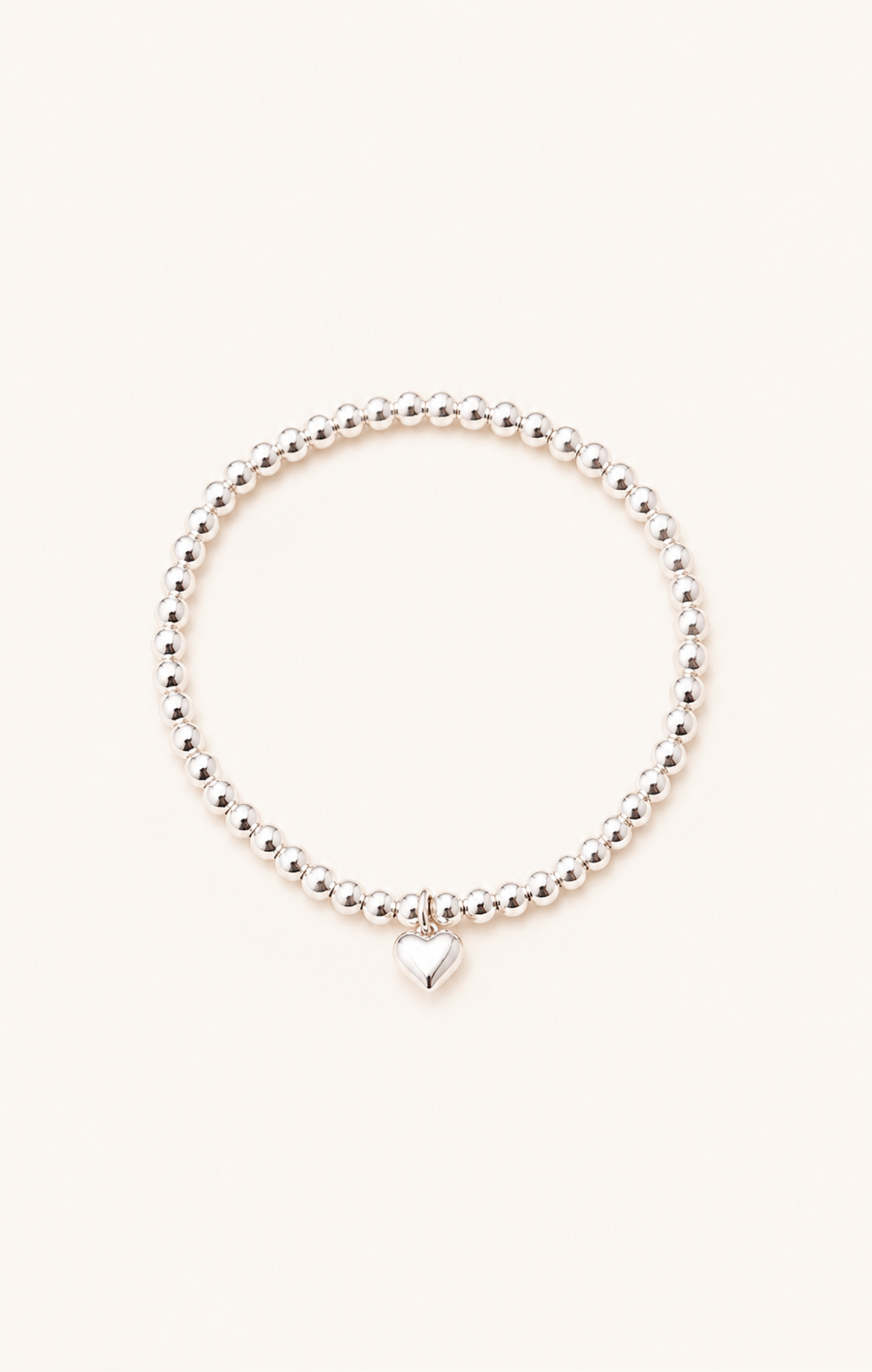 women wearing a silver bracelet on the beach