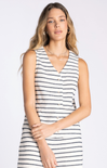 Woman wearing a black and white striped dress on a white background