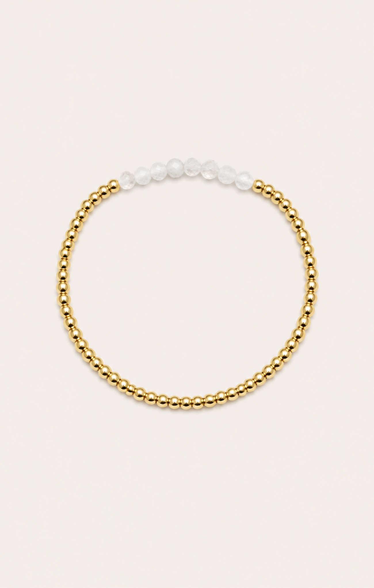 gold bracelet on neutral surface