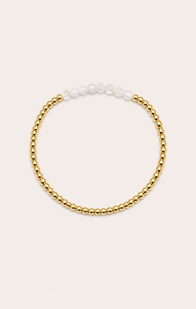 gold bracelet on neutral surface