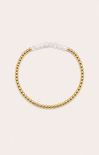 gold bracelet on neutral surface