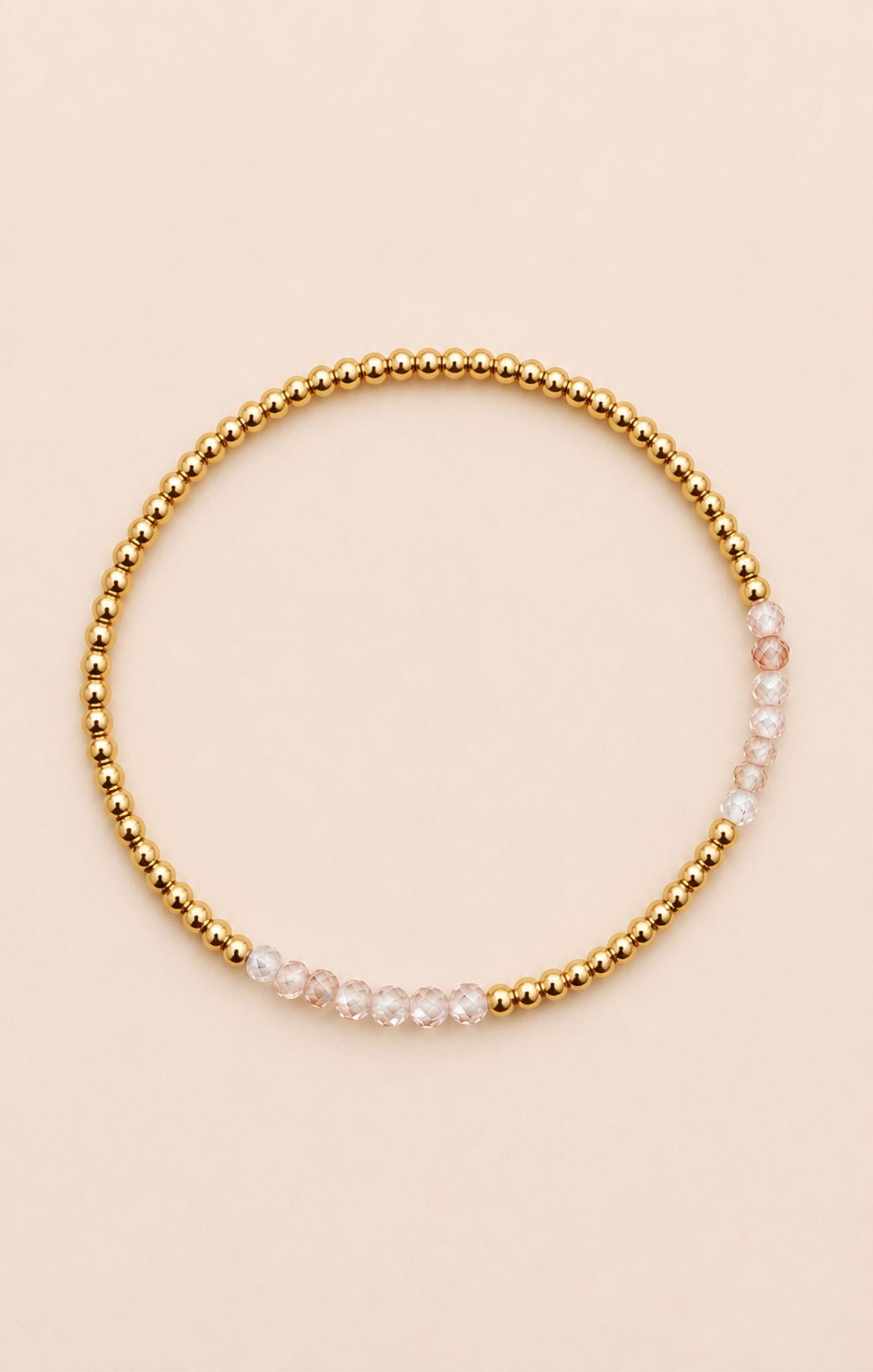 gold bracelet on neutral background