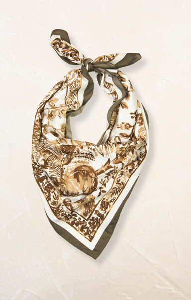 Decorative scarf with intricate patterns on a light background