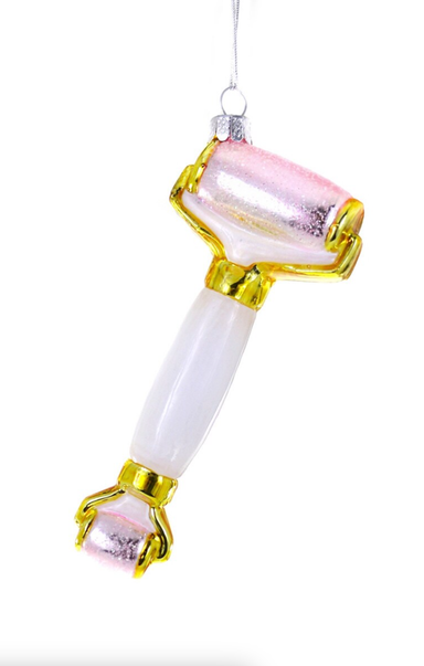 Roller tool with white handle and pink roller on a white background