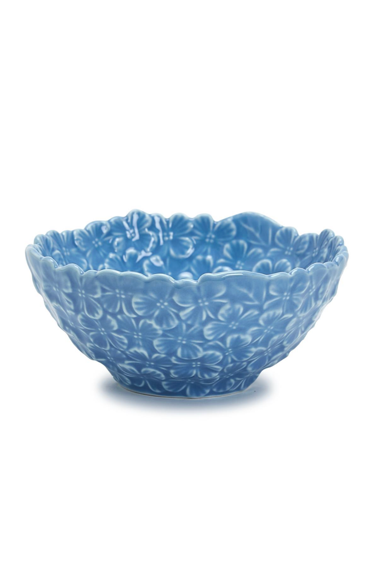 Blue ceramic bowl with floral patterns on a white background