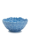 Blue ceramic bowl with floral patterns on a white background