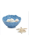 Blue decorative bowl with seashells and starfish on a white background