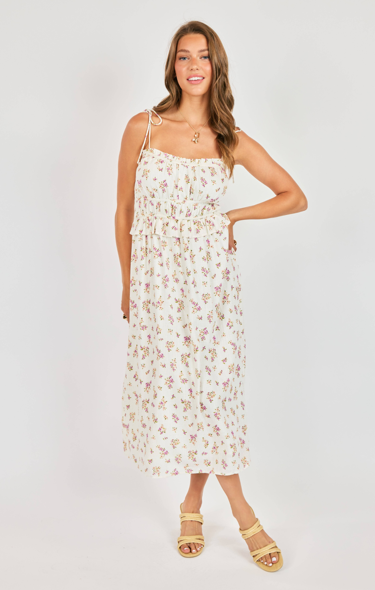 Woman wearing a floral dress on a white background