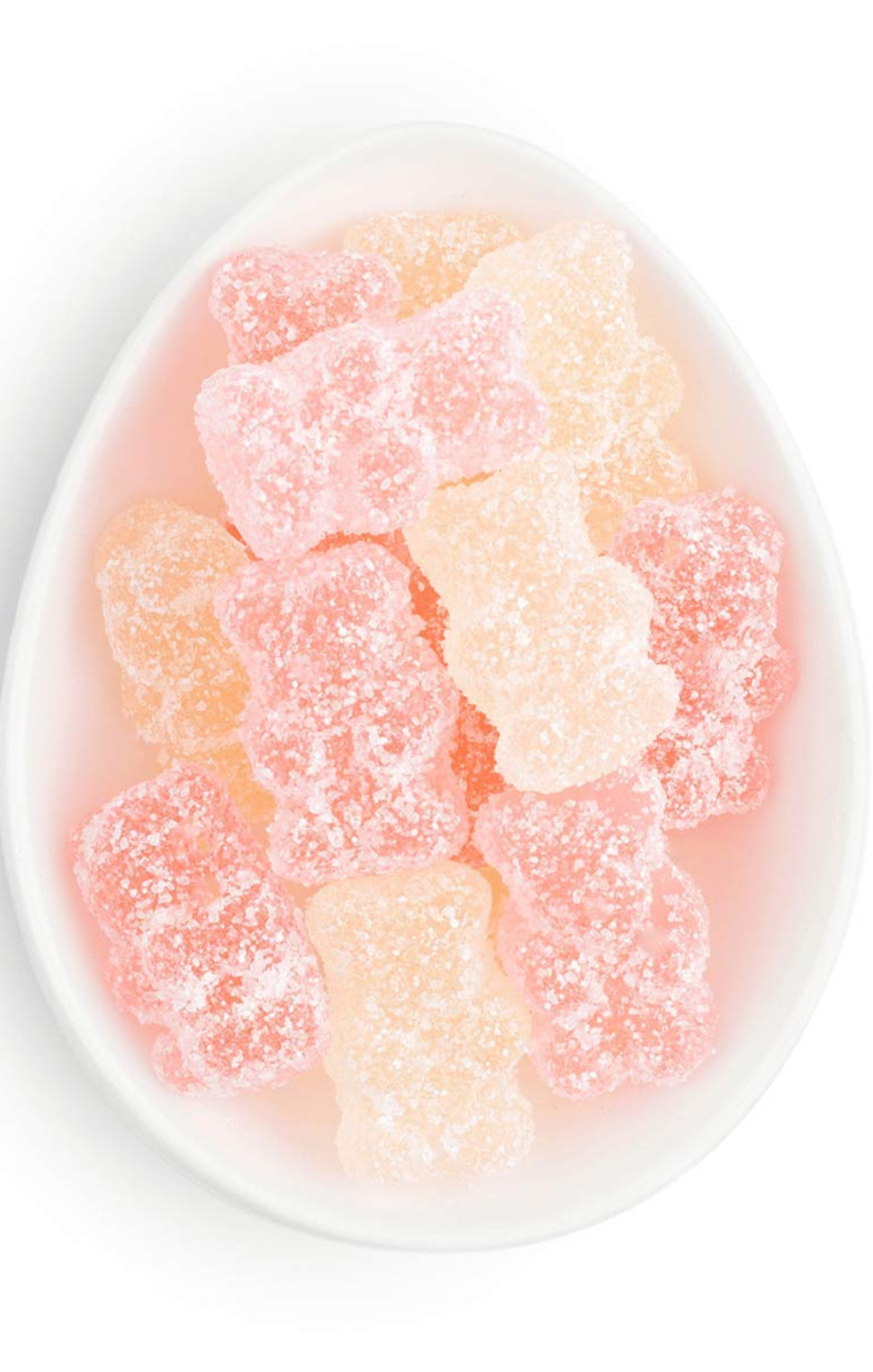 Gummy bears in a white bowl on a white background