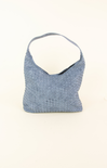 Blue textured handbag on a light beige background