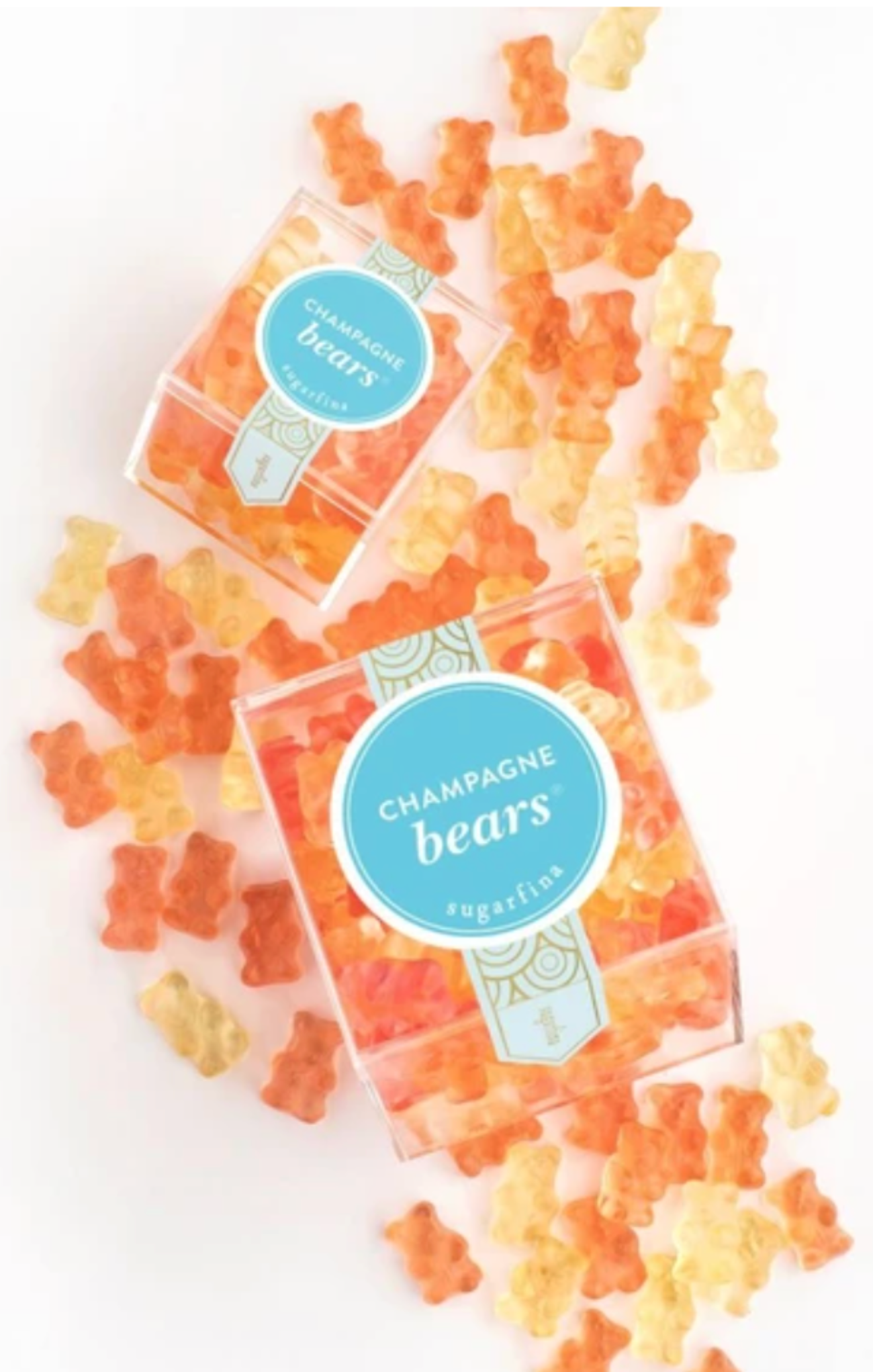 Two boxes of Champagne Bears gummy bears on a white background