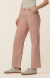 Person wearing pink striped pants on a beige background
