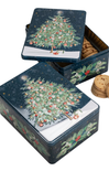 Decorative cookie tin with Christmas tree design on a white background