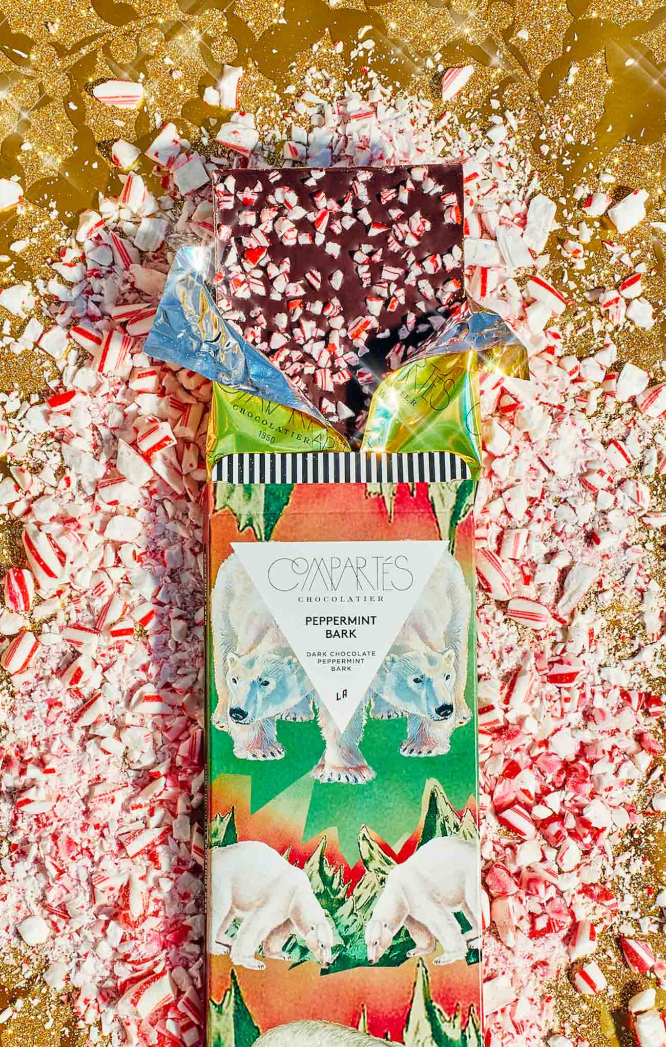 Cosmpolites peppermint bars packaging on a bed of crushed candy canes