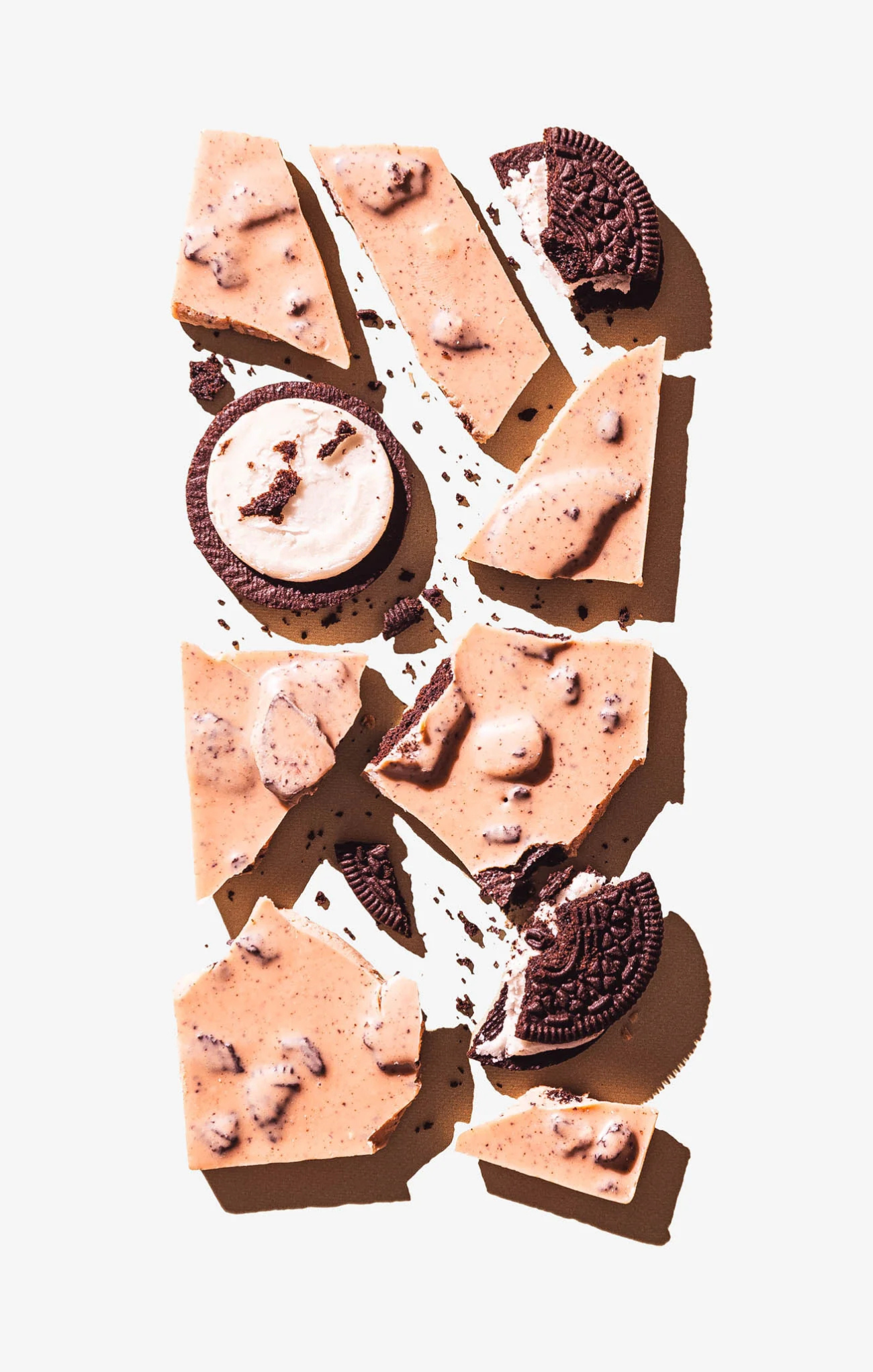 Chocolate cookie dough bark with cookies on a white background