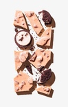 Chocolate cookie dough bark with cookies on a white background