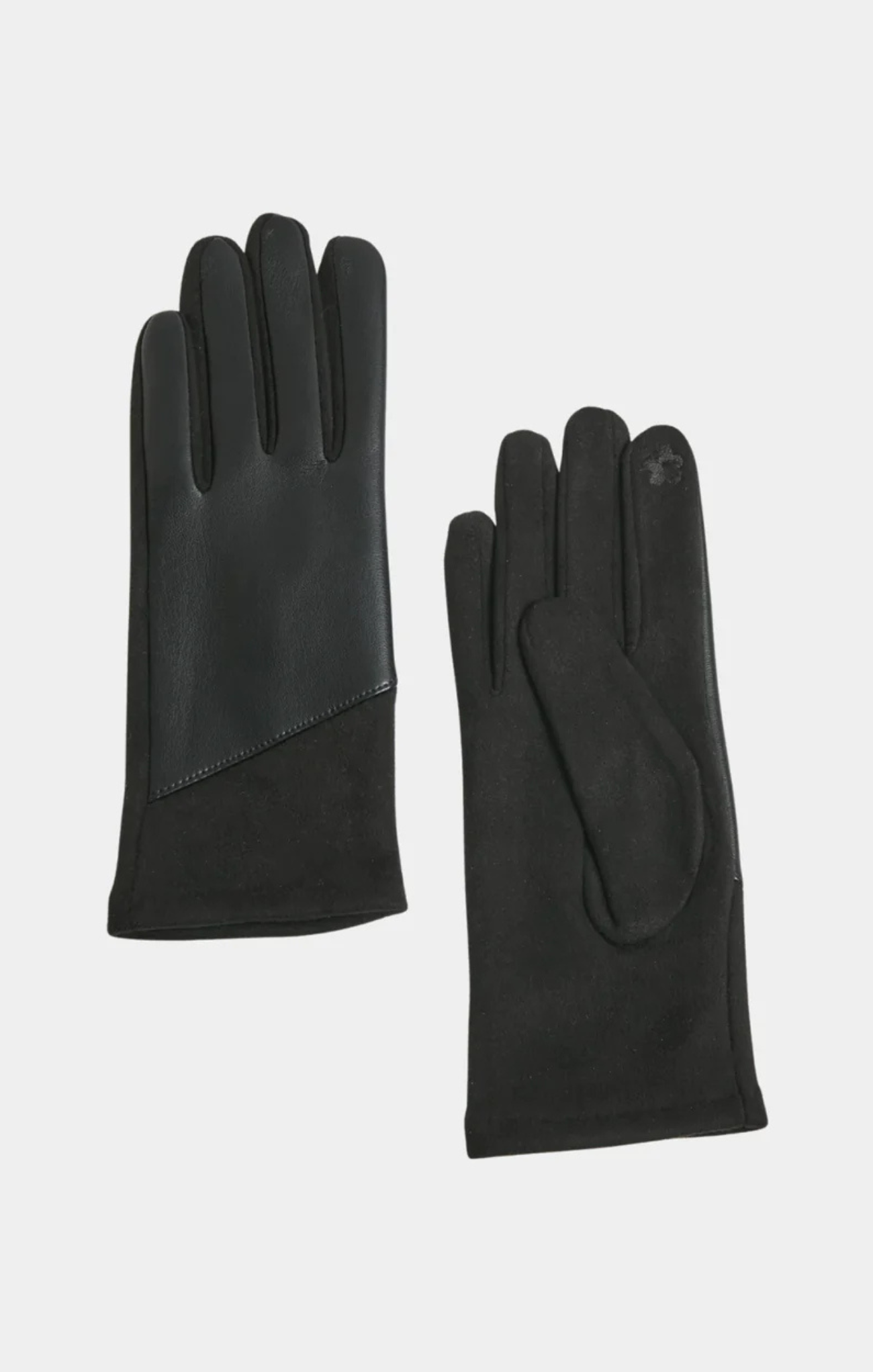 Pair of black gloves on a light gray background