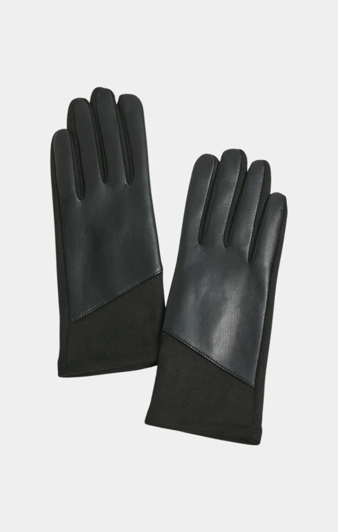 Pair of black leather gloves on a light gray background