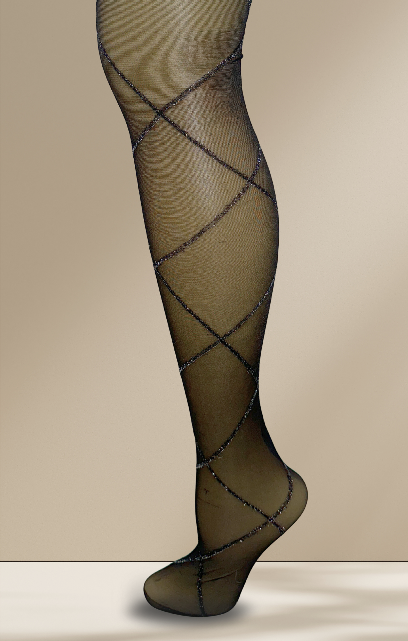Black fishnet stockings on a beige background