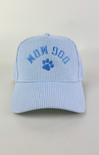 Light blue and white striped baseball cap with “Dog Mom” embroidered in blue lettering above a blue paw print on the front.