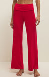 Red pants worn by a person on a plain background