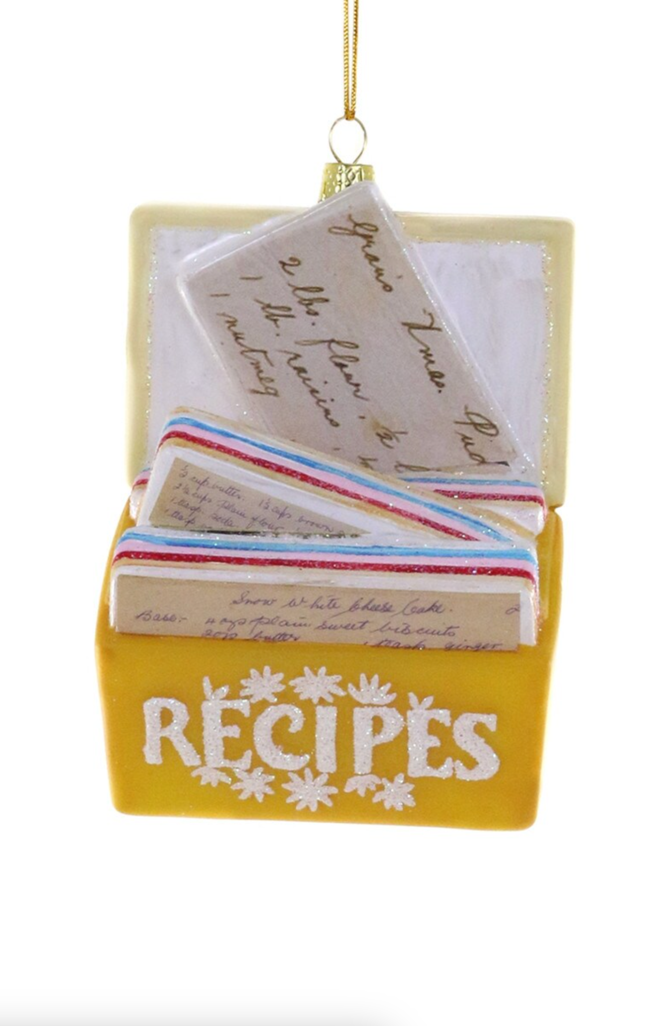 Yellow recipe box with cards inside on a white background