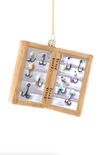 Fishing hook display case with various hooks on a white background