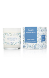 blue floral candle that says old whaling co on it on white background