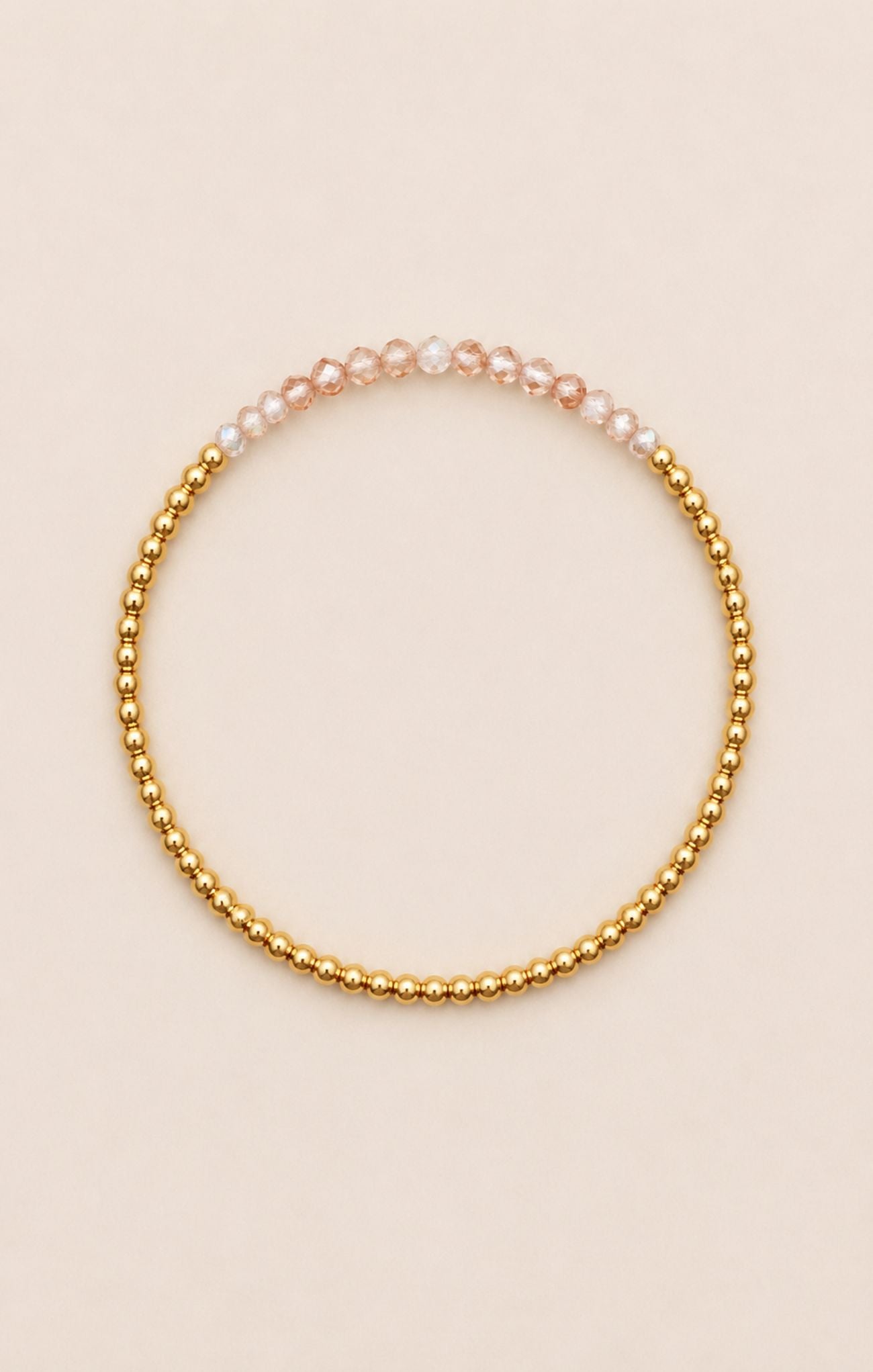 gold bracelet on neutral background