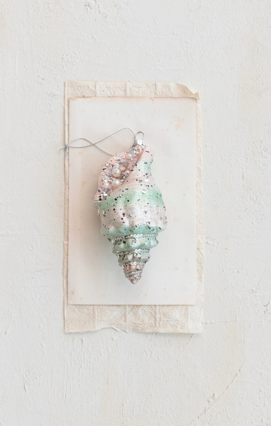 Decorative shell with pearls on a white background