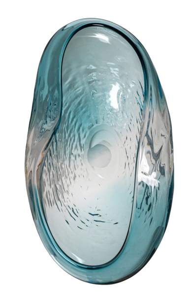 Blue glass bowl with textured surface on a white background