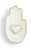 Decorative ceramic hand-shaped dish with a heart cutout on a white background