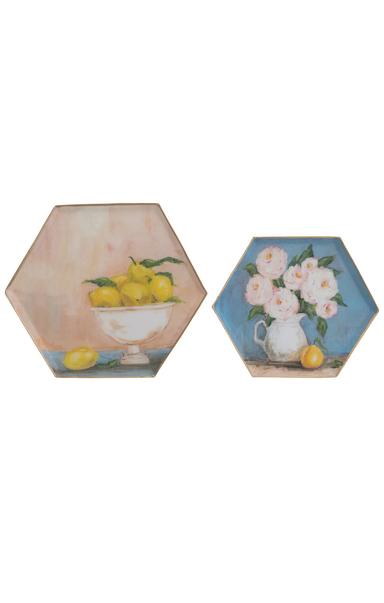 Two hexagonal coasters with floral and fruit designs on a white background