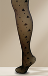 Black patterned tights on a beige background