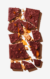 Chocolate bark with nuts and caramel on a white background