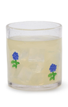Clear glass candle with blue floral designs on a white background