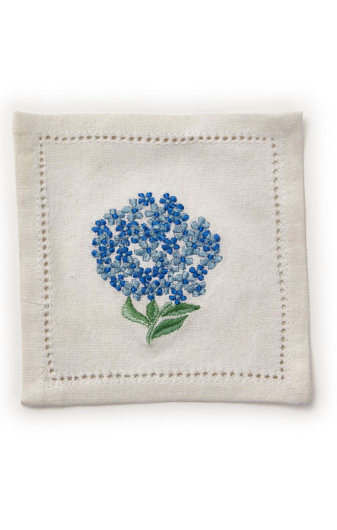 Embroidered blue flower on a white fabric square