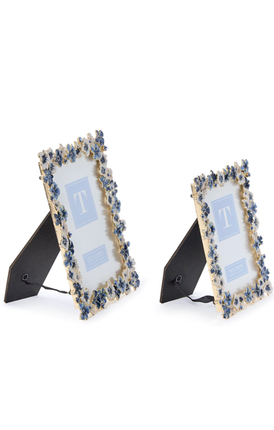 Two decorative picture frames with floral designs on a white background