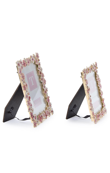 Two decorative picture frames with floral designs on a white background