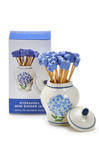 Ceramic jar with blue floral design containing bamboo picks, next to a box labeled 'Hydrangea Mini Ginger Jar' on a white background.