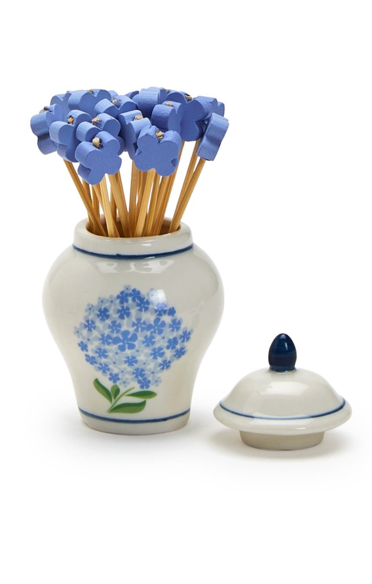 Ceramic jar with blue floral design containing toothpicks on a white background